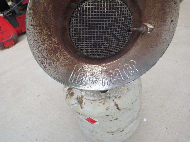 Propane tank with some propane and a sunflower heater that may need