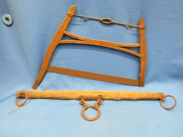 Antique bucksaw and an evener