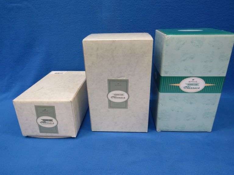 Three Hallmark Kiddie Car Classic diecast vehicles in original boxes.