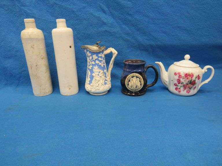 Teapot, crockery, and a Renascence mug