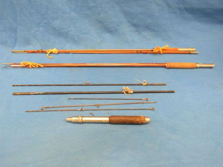 Three vintage fly rods. One is marked Jim Dandy. Cloth case is in poor condition.