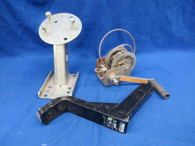 2" hitch with 8" drop, trailer winch, and a spare tire mounting bracket for a trailer, plus a tote