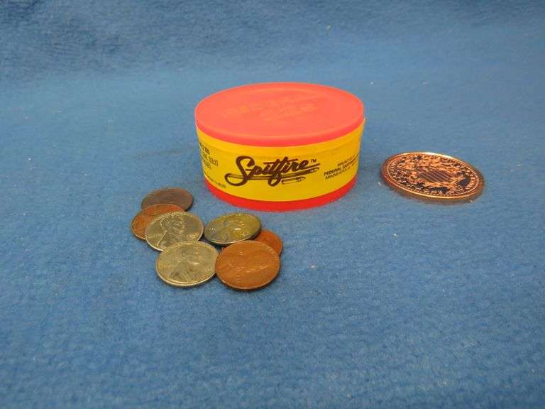 Fifty Federal 22 LR Spitfire, a one ounce copper medallion, six wheat pennies, and a 1964 D Lincoln