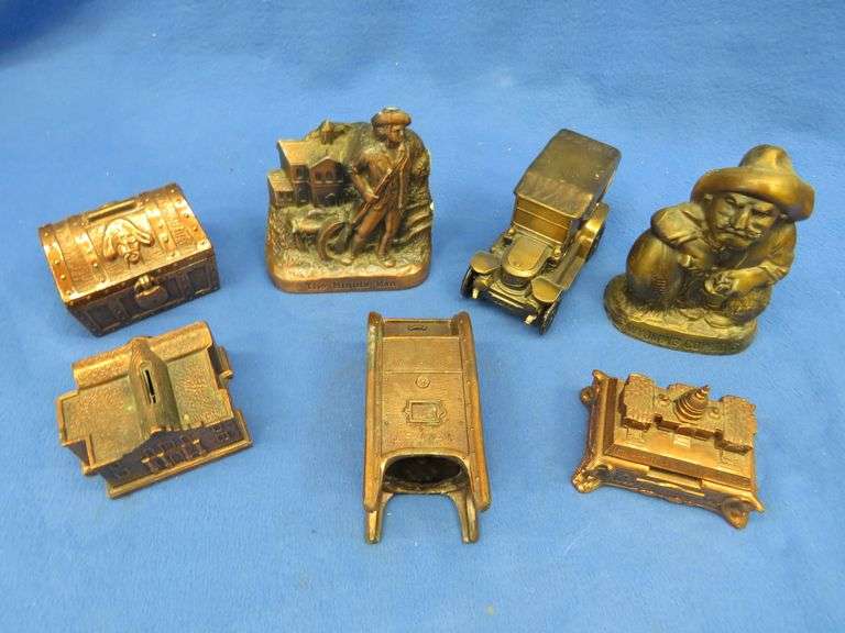 Seven collectible metal banks