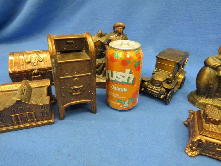 Seven collectible metal banks