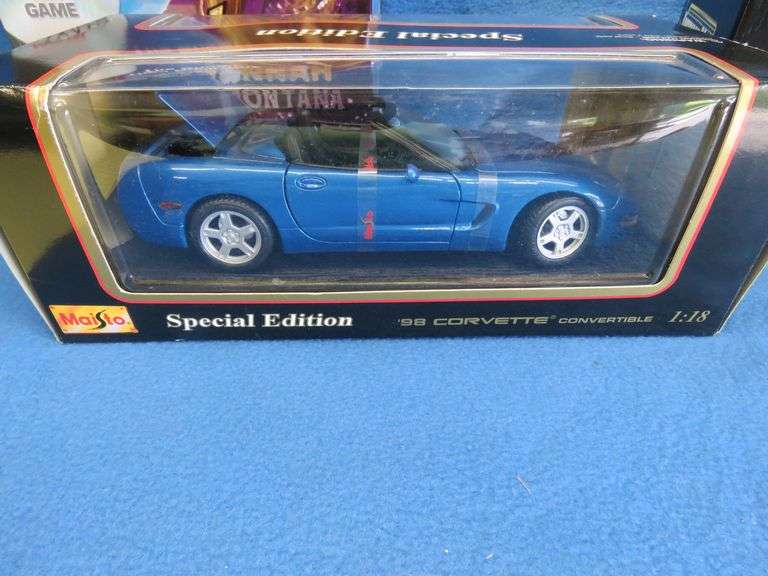 Hannah Montana game, Maisto 1998 Corvette Convertible 1:18, and an AM Muscle 1967 Corvette Stingray 