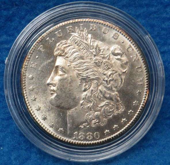 1880 S Morgan silver dollar in BU condition with a a copy of the Certificate of Authenticity