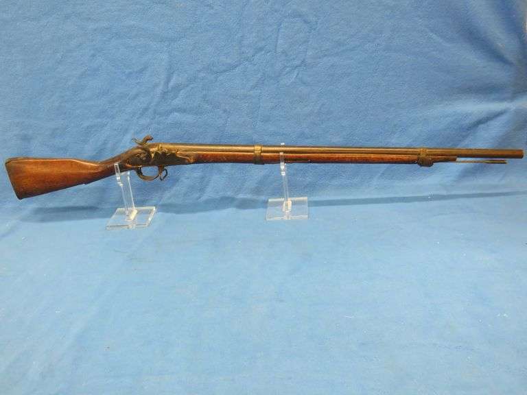 Antique black powder rifle.  Unknown maker or caliber.  Not safe to shoot.  Non-operable hammer and 