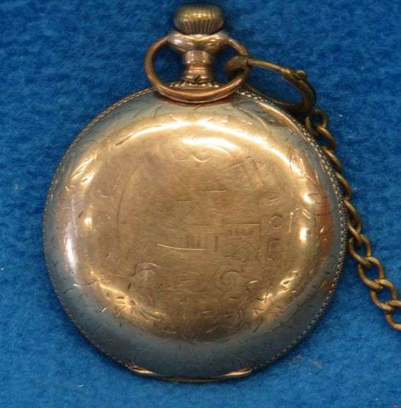 Gold watch with chain and key as described: