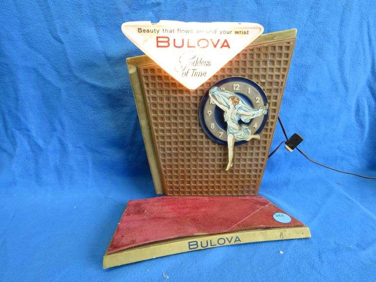Vintage store display Bulova watch sign works and flashes.