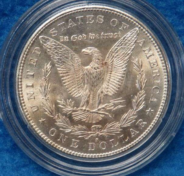 1880 S Morgan silver dollar in BU condition with a a copy of the Certificate of Authenticity