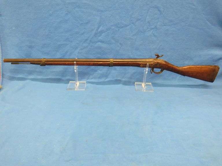 Antique black powder rifle.  Unknown maker or caliber.  Not safe to shoot.  Non-operable hammer and 