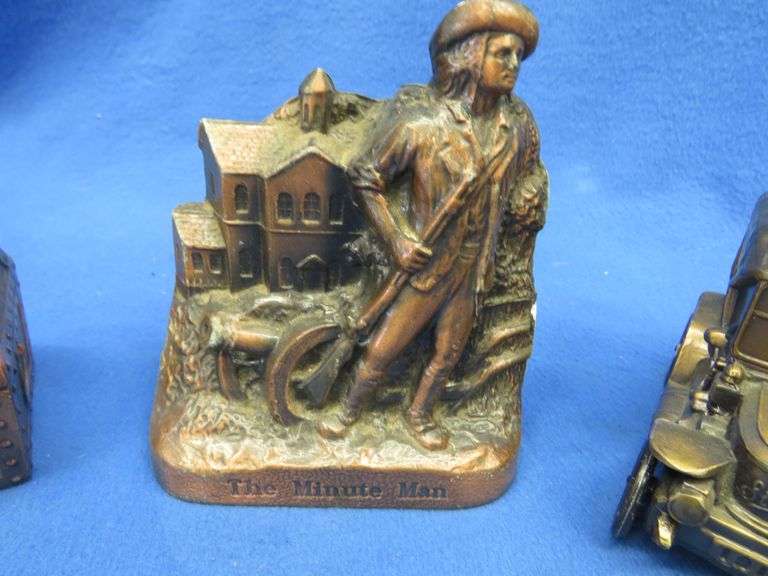 Seven collectible metal banks