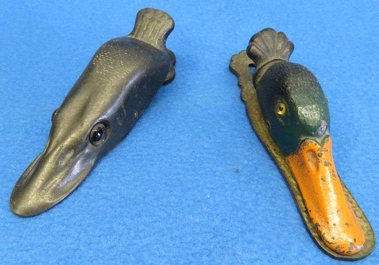Old cast-iron northern pike and mallard paper clips with glass eyes