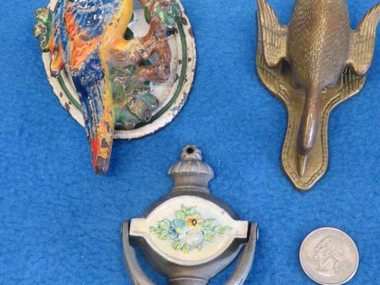 Cast iron door knockers and a brass paper clip goose
