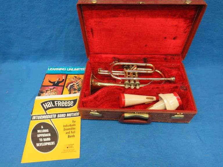 Frank Horton Model C301 cornet. Good used condition.  Valves work good.  Includes two mutes, case, a