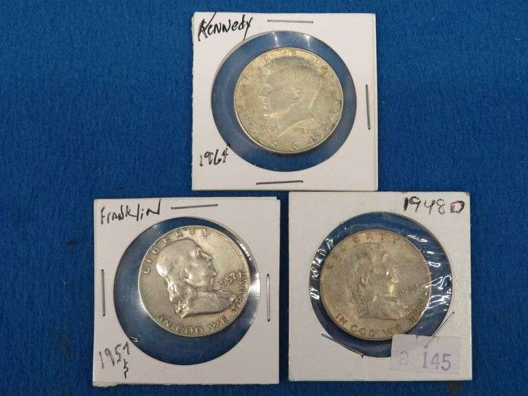 Two Franklin and one Kennedy half-dollars