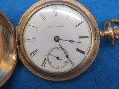 Gold watch with chain and key as described: