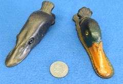 Old cast-iron northern pike and mallard paper clips with glass eyes