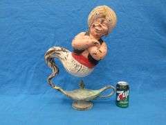 Two wishes left with this plaster Genie and bottle.  20" tall with original paint.