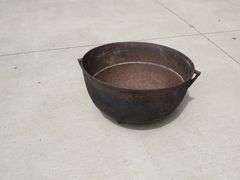 Vintage cast iron kettle 20" wide x 10 1/2" deep, has all three feet and the handle