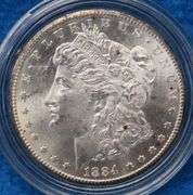 1884 CC Morgan silver dollar in BU condition with a Certificate of Authenticity and display box. Ple