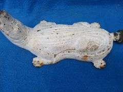Antique cast iron lawn sprinkler in the form of an alligator.  Unknown maker.