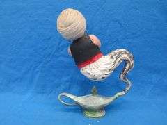Two wishes left with this plaster Genie and bottle.  20" tall with original paint.