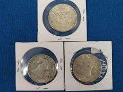 Two Franklin and one Kennedy half-dollars