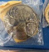 Eight belt buckles from fraternal organizations and one from Smith and Wesson. Some are marked as br