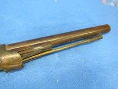Antique black powder rifle.  Unknown maker or caliber.  Not safe to shoot.  Non-operable hammer and 