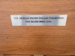 1884 CC Morgan silver dollar in BU condition with a Certificate of Authenticity and display box. Ple