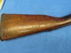 Antique black powder rifle.  Unknown maker or caliber.  Not safe to shoot.  Non-operable hammer and 