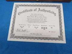 1880 S Morgan silver dollar in BU condition with a a copy of the Certificate of Authenticity