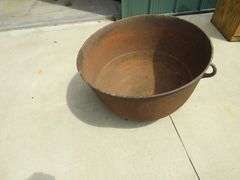 Vintage cast iron kettle 26" wide x 17" deep, has all three feet, marked 30 on the bottom