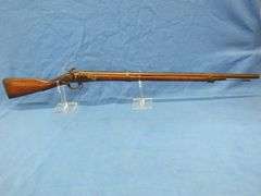Antique black powder rifle.  Unknown maker or caliber.  Not safe to shoot.  Non-operable hammer and 