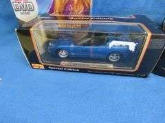 Hannah Montana game, Maisto 1998 Corvette Convertible 1:18, and an AM Muscle 1967 Corvette Stingray 
