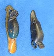 Old cast-iron northern pike and mallard paper clips with glass eyes