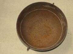 Vintage cast iron kettle 20" wide x 10 1/2" deep, has all three feet and the handle