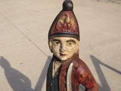 Two matching Hessian soldier antique cast iron andirons