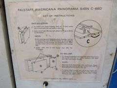 Falstaff American panorama backlit rolling motion sign.  Scenes changes from fall, winter, and summe