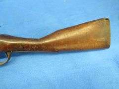 Antique black powder rifle.  Unknown maker or caliber.  Not safe to shoot.  Non-operable hammer and 