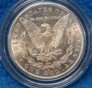 1880 S Morgan silver dollar in BU condition with a a copy of the Certificate of Authenticity