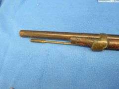 Antique black powder rifle.  Unknown maker or caliber.  Not safe to shoot.  Non-operable hammer and 