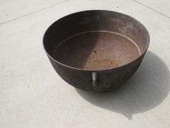 Vintage cast iron kettle 20" wide x 10 1/2" deep, has all three feet and the handle