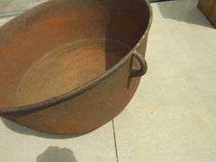 Vintage cast iron kettle 26" wide x 17" deep, has all three feet, marked 30 on the bottom