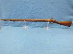 Antique black powder rifle.  Unknown maker or caliber.  Not safe to shoot.  Non-operable hammer and 