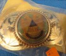 Eight belt buckles from fraternal organizations and one from Smith and Wesson. Some are marked as br