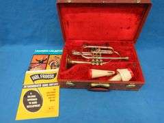 Frank Horton Model C301 cornet. Good used condition.  Valves work good.  Includes two mutes, case, a