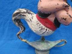 Two wishes left with this plaster Genie and bottle.  20" tall with original paint.